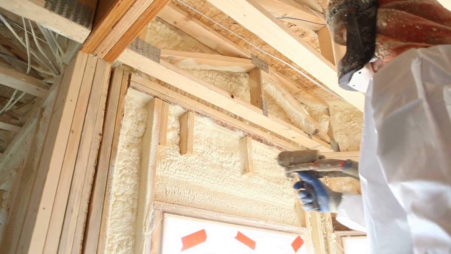 Great White Spray Foam crew applying spray foam between wall studs
