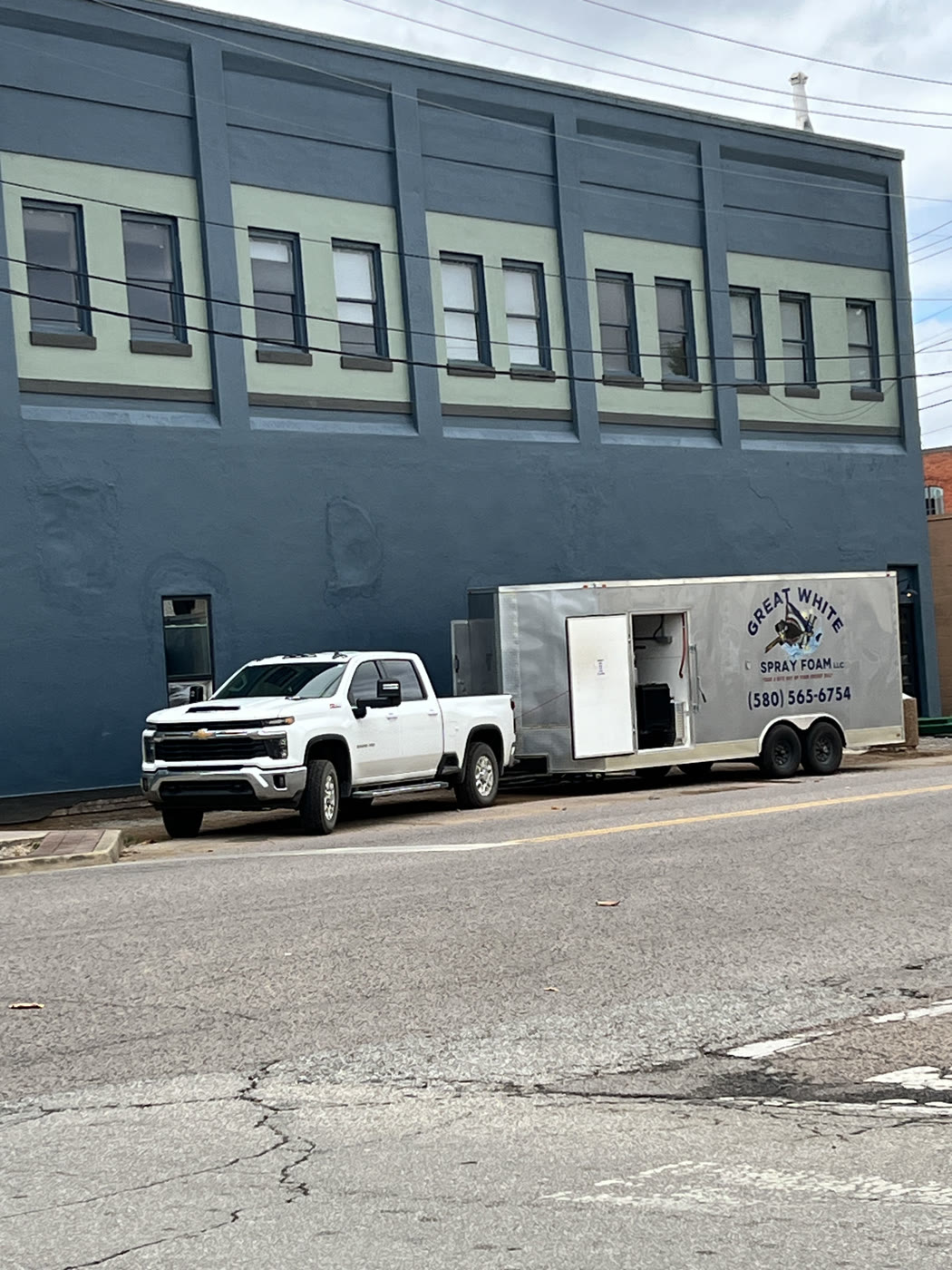 Great White Spray Foam truck and rig on site in downtown Durant