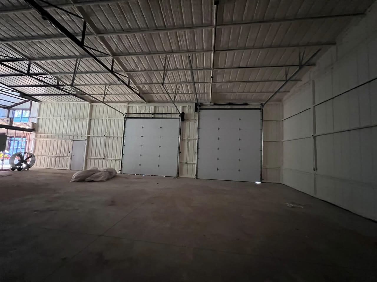 Metal shop interior fully insulated with spray foam